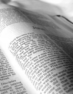 Reading the Bible Photograph of a Bible open to the beginning of the Gospel of John